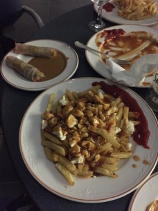 Veggie spring rolls and poutine
